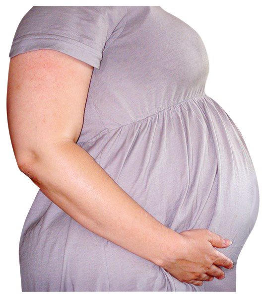 pregnant women holding stomach